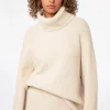 Beige patentstickad tröja