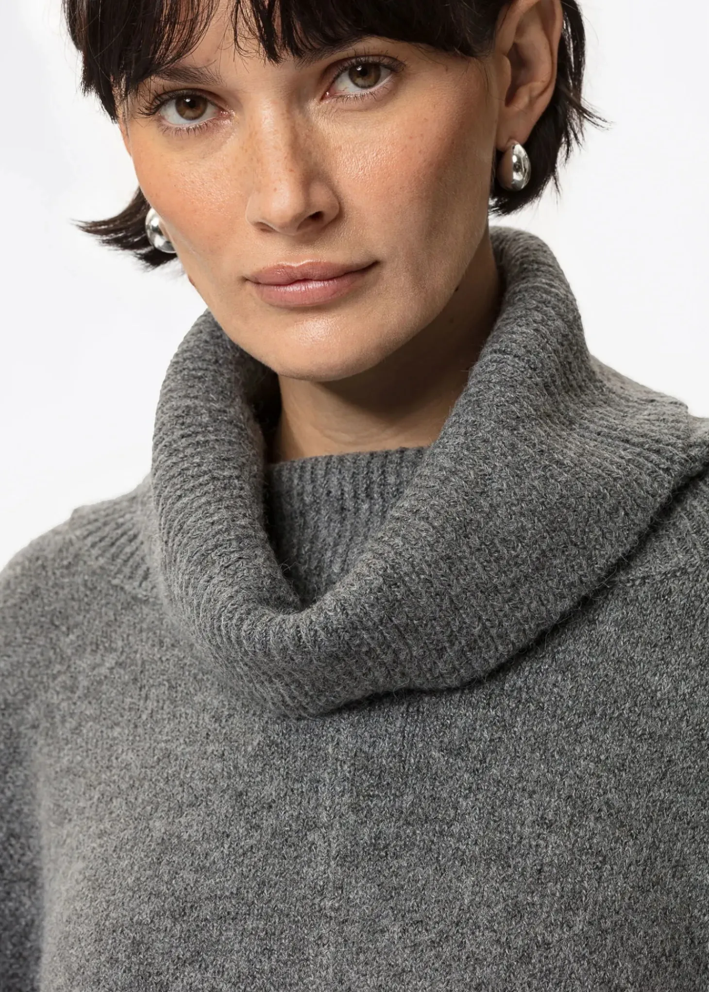Grå poncho