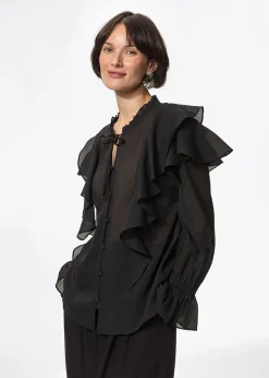 Svart blus med volang